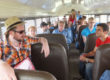 Director Scott Belyea talking to actors on bus